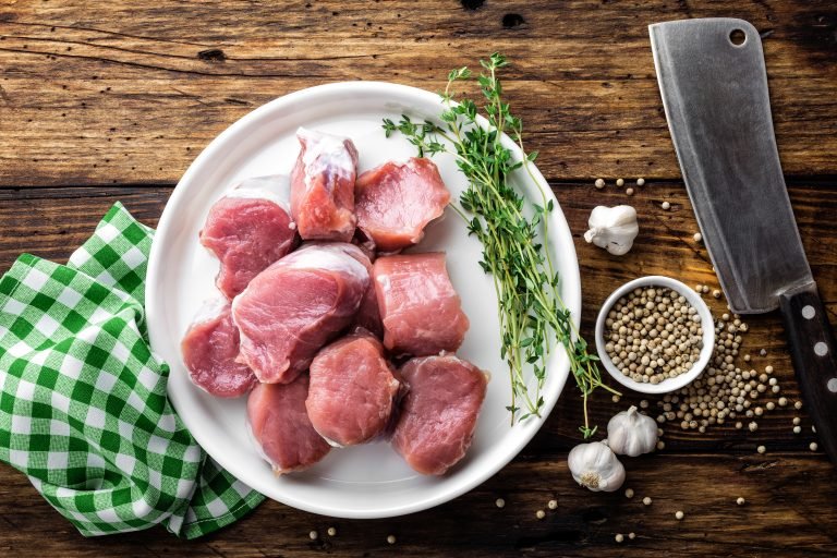Fresh Raw Pork Tenderloin, Chopped Meat On Dark Wooden Rustic Background, Top View